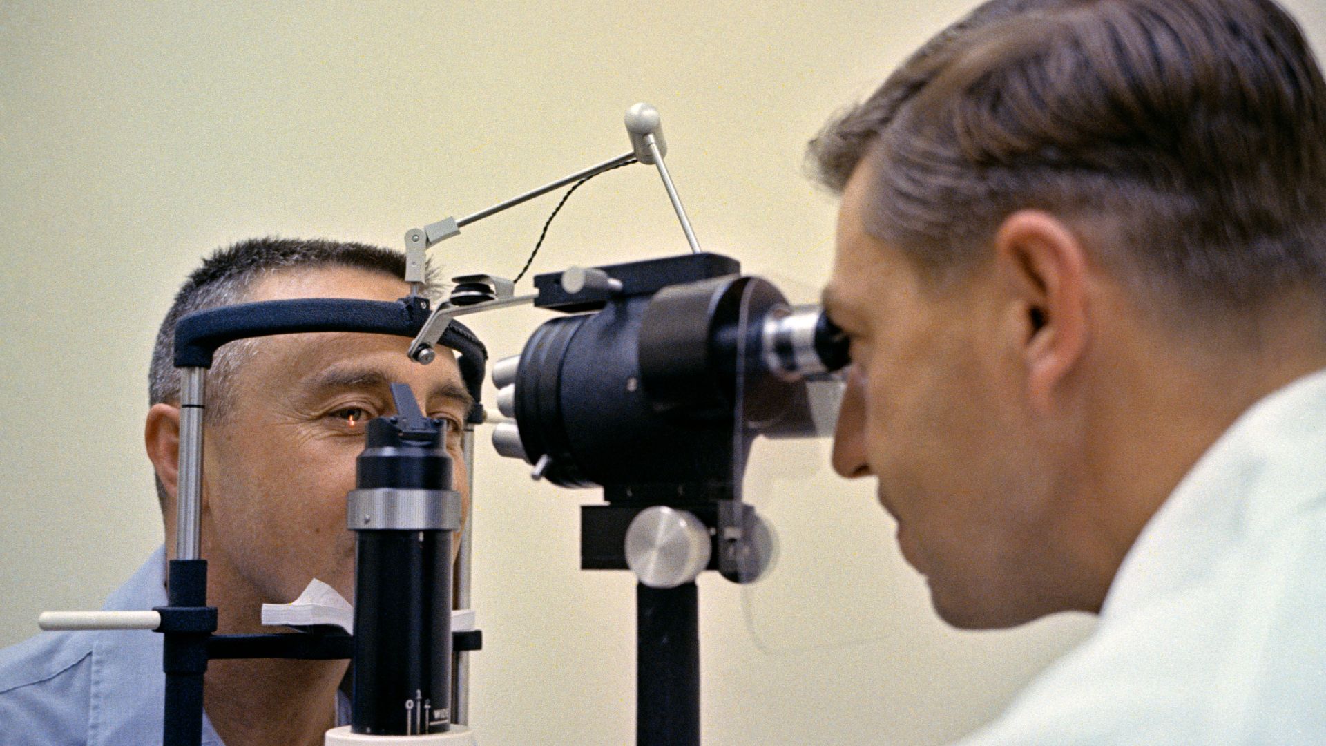 Astronaut Virgil I. Grissom, command pilot for the Gemini-Titan 3 mission, receives an eye examination during the physical given to the GT-3 crew two days before launch.