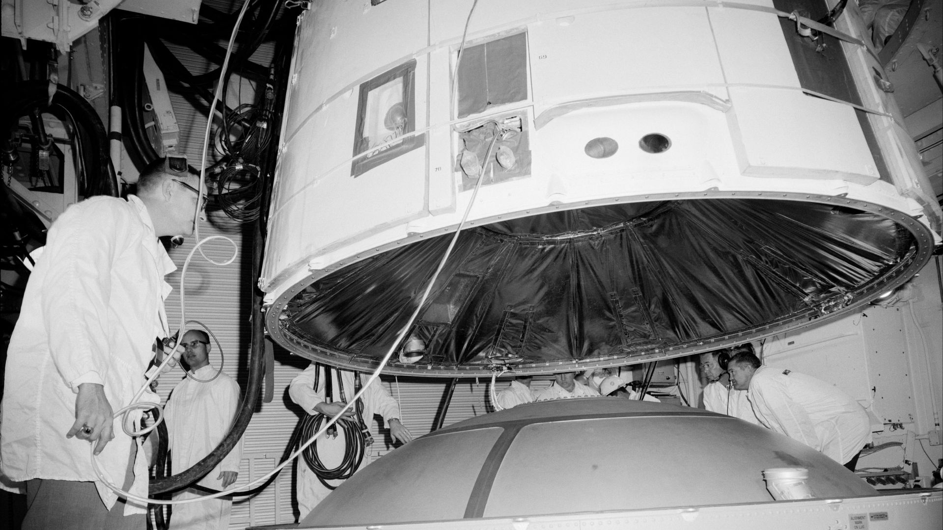 The Gemini 3 spacecraft is mated with the Titan II launch vehicle in the white room of Pad 19 at the Kennedy Space Center. Virgil I. (Gus) Grissom and John Young rode the capsule into space on March 23, 1965 for a mission lasting almost five hours. The pa