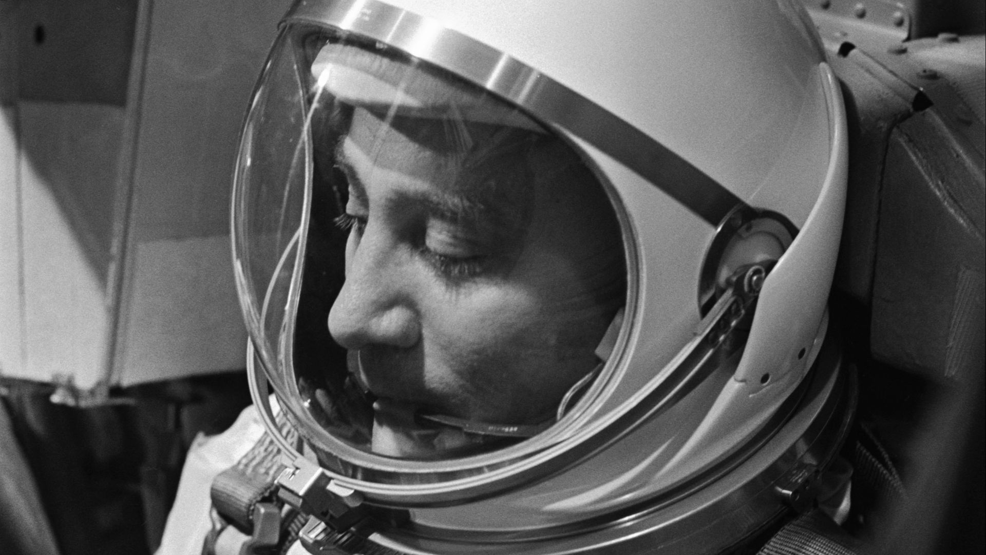 S65-20605 (23 March 1965) --- Astronaut Virgil I. Grissom, the command pilot of the Gemini-Titan 3 mission, is shown through the window of the open hatch on the Gemini spacecraft in the white room on the morning of the launch.