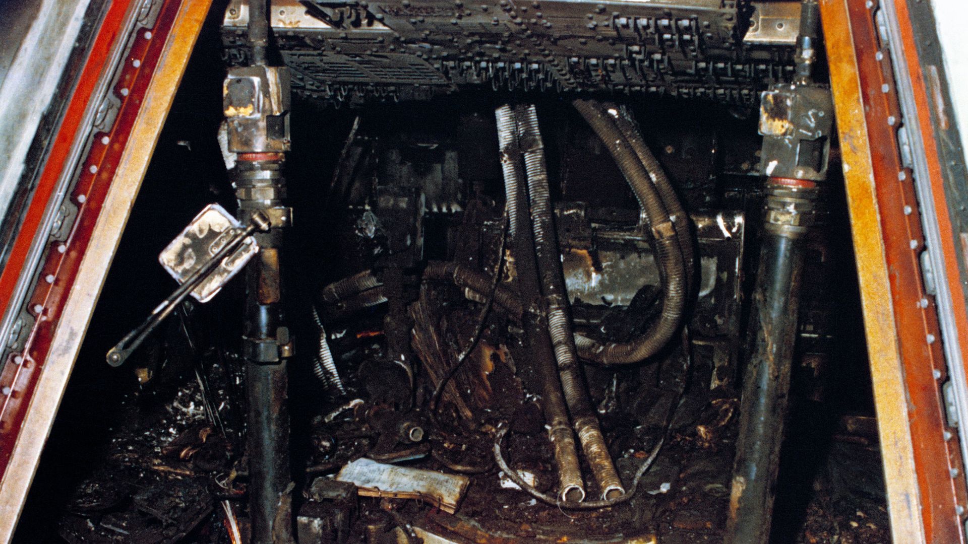 Officially designated Apollo/Saturn 204, but more commonly known as Apollo 1, this close-up view of the interior of the Command Module shows the effects of the intense heat of the flash fire which killed the prime crew during a routine training exercise.