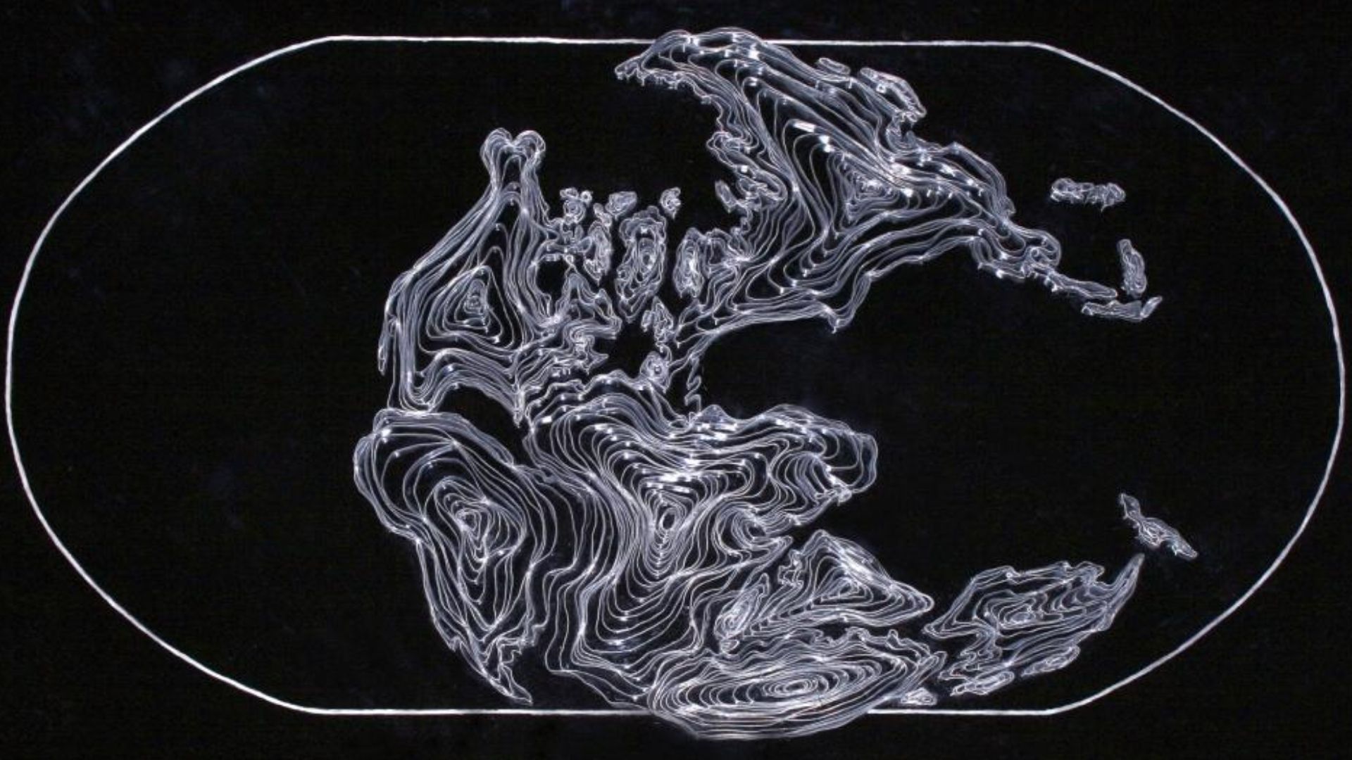Lead tape traces the contours of the continents as they were 200 million years ago. This work is compared to a similar work showing the continents in their present position.