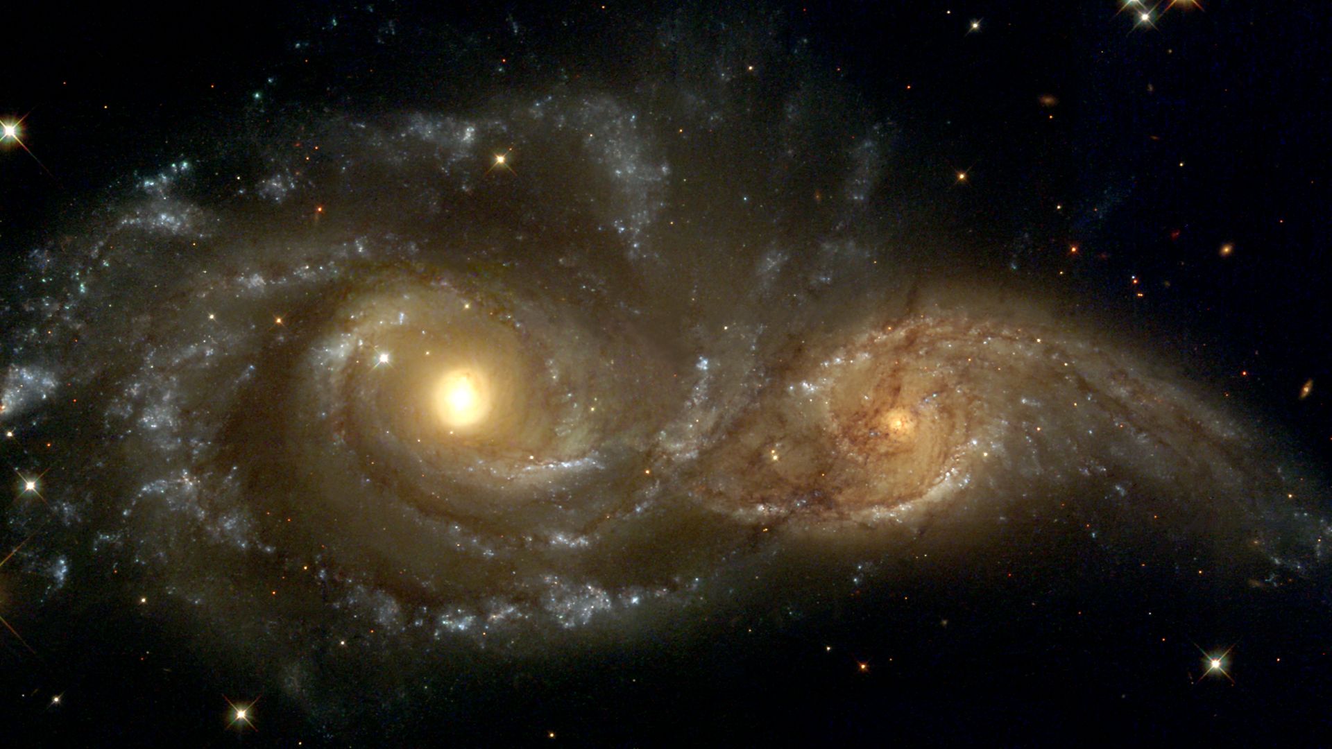Near colliding NGC 2207 and IC 2163 as seen by the NASA/ESA Hubble Space Telescope.