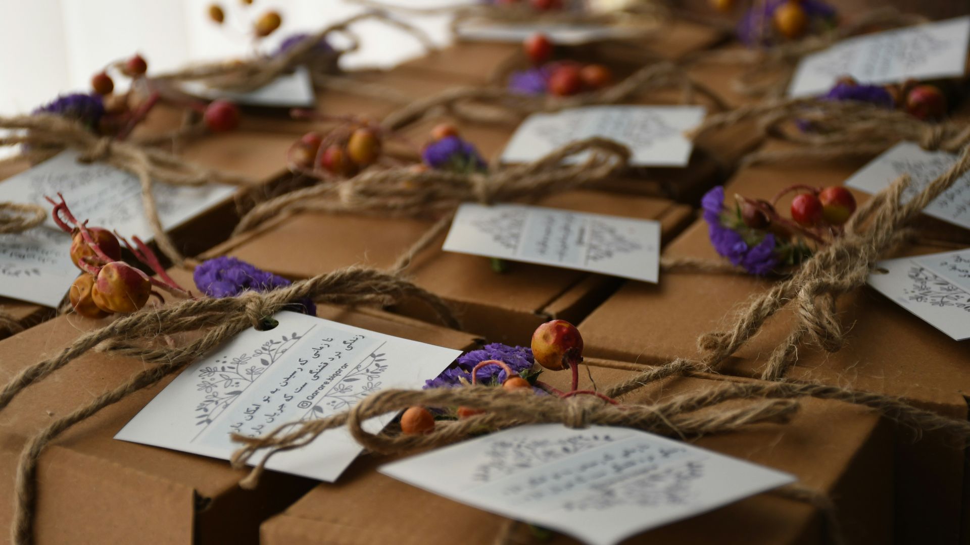 a table topped with lots of brown boxes covered in notes