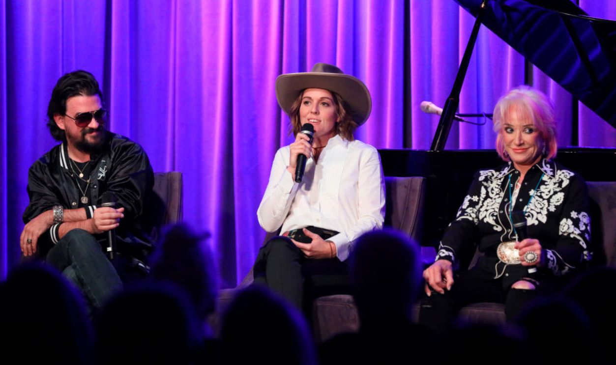 LOS ANGELES, CALIFORNIA - OCTOBER 03: Shooter Jennings, Brandi Carlile and Tanya Tucker speak onstage at The Drop: Tanya Tucker at the GRAMMY Museum on October 03, 2019 in Los Angeles, California.