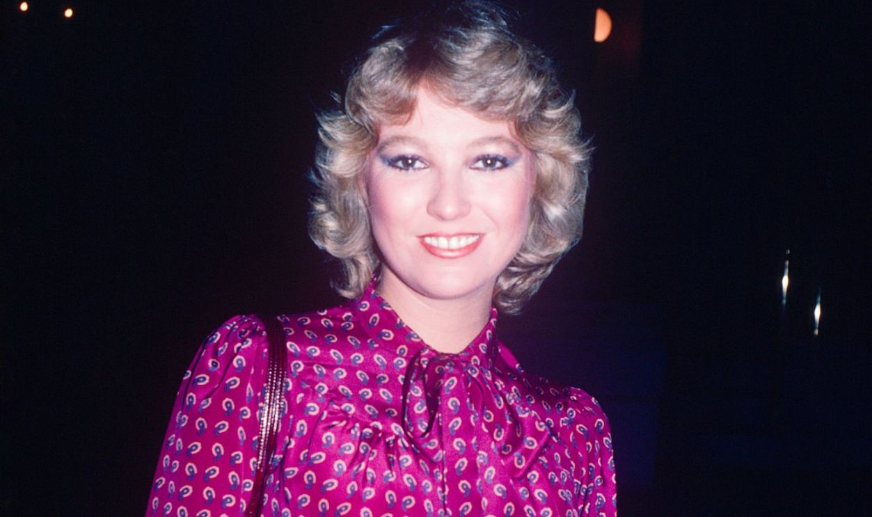 Tanya Tucker wearing a fuchsia paisley blouse; circa 1970; New York. 