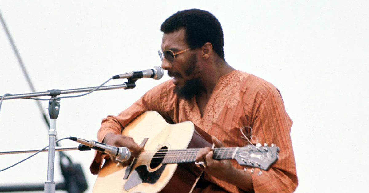 American musician Richie Havens performs onstage at the Woodstock Music and Arts Fair in Bethel, New York, August 15, 1969
