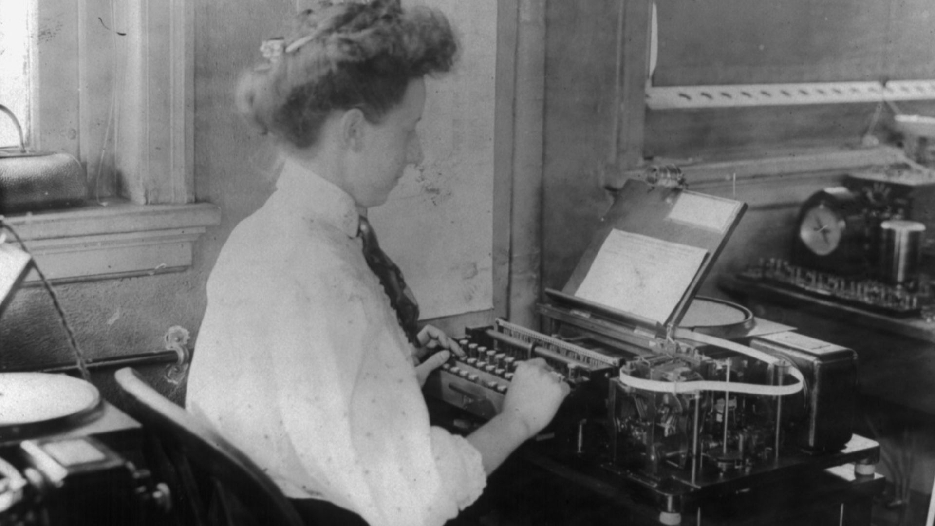 Title: Barclay telegraph instrument. Stamping machine with woman operator
Abstract/medium: 1 photographic print.