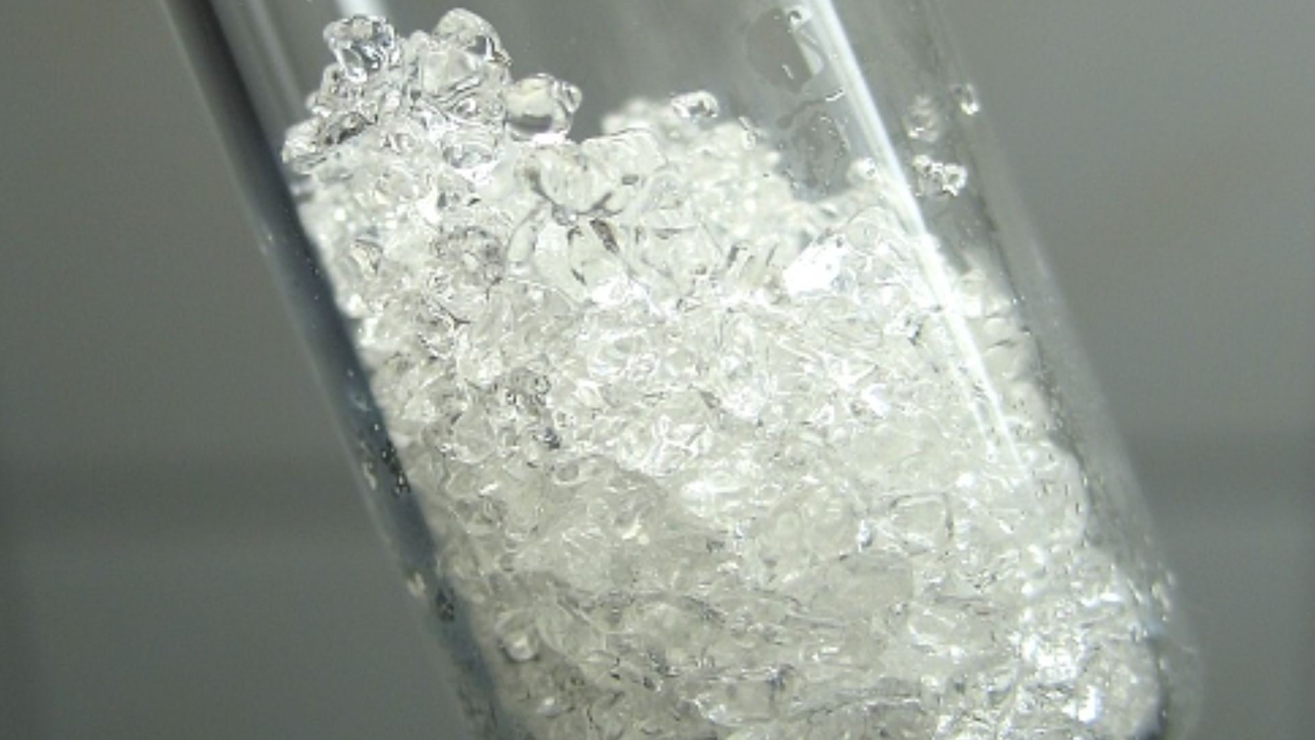 Appr. 2 grams of phenol in glass vial.