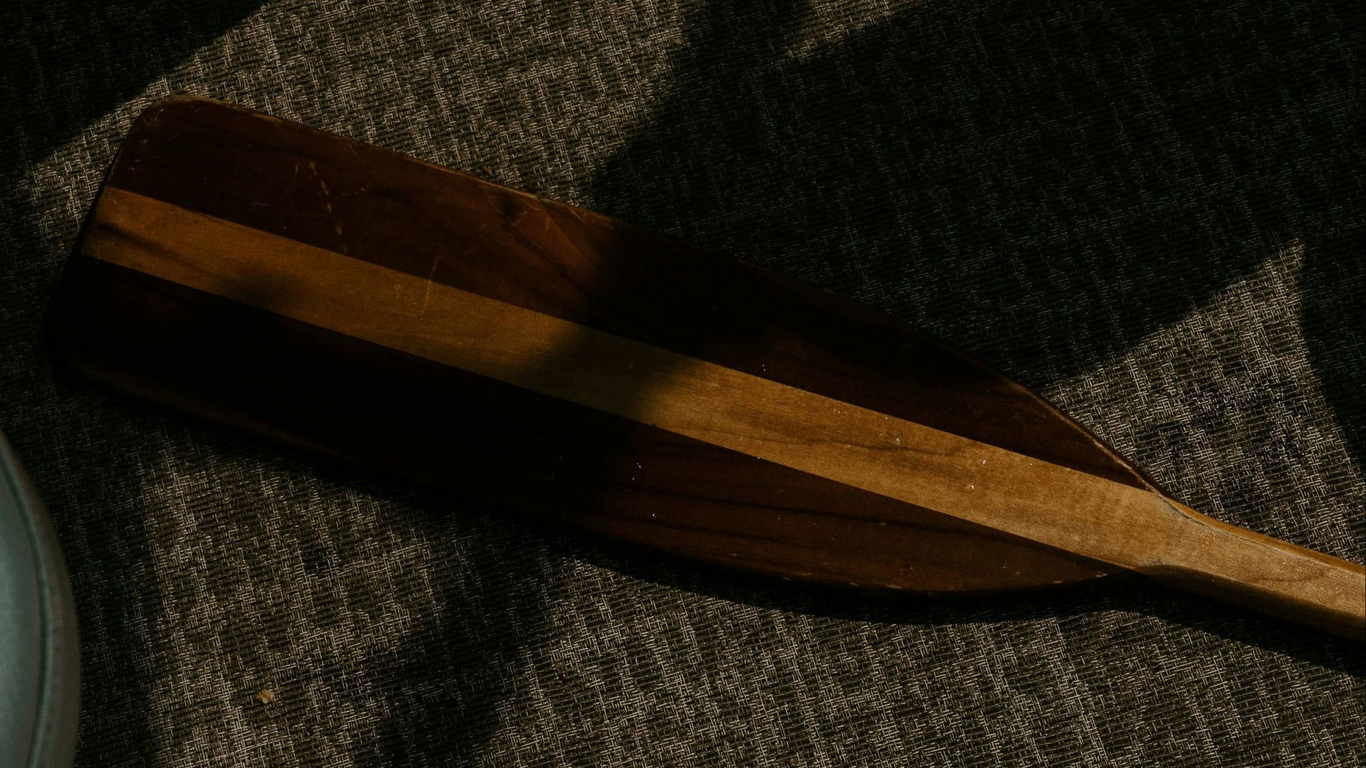 brown wooden handle knife on gray textile