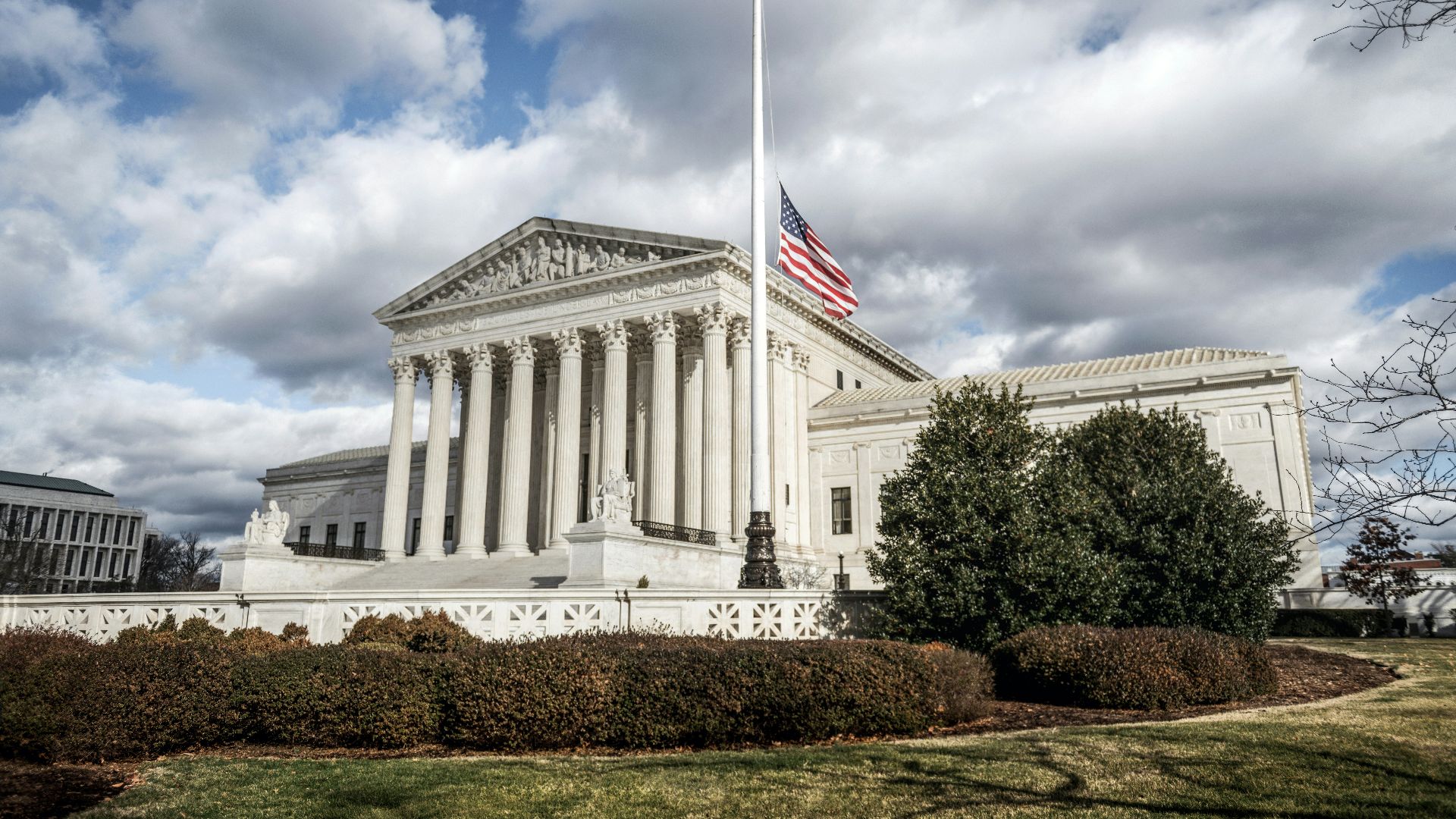 a large building with a flag on top of it