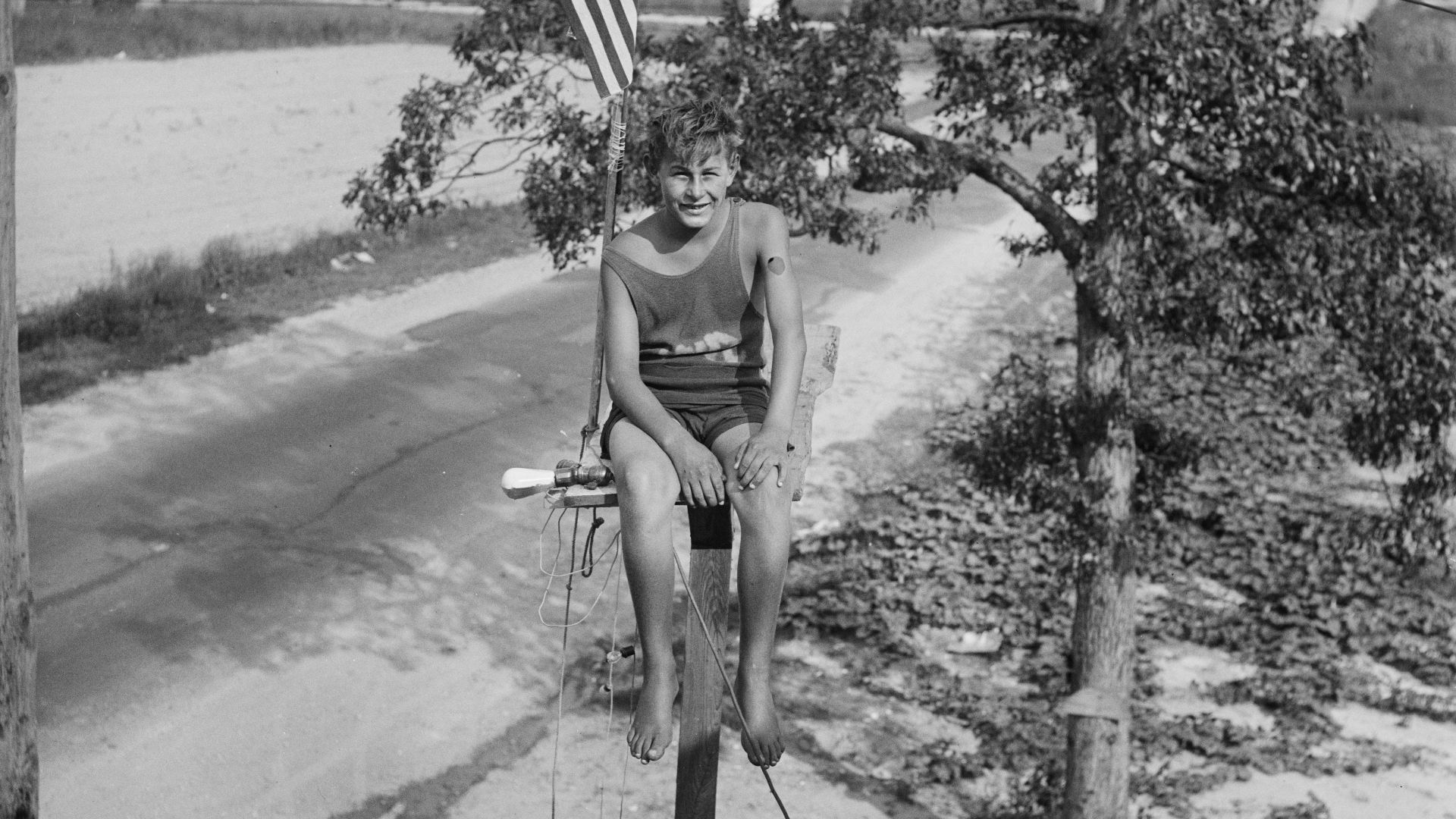Title: Maryland youth breaks pole sitting record. William Ruppert, 14-year-old youth of Colgate, Maryland, as he appeared atop the flag pole in the yard of his home yesterday after breaking the pole sitting record of 23 days set by Shipwreck Kelly. Young 