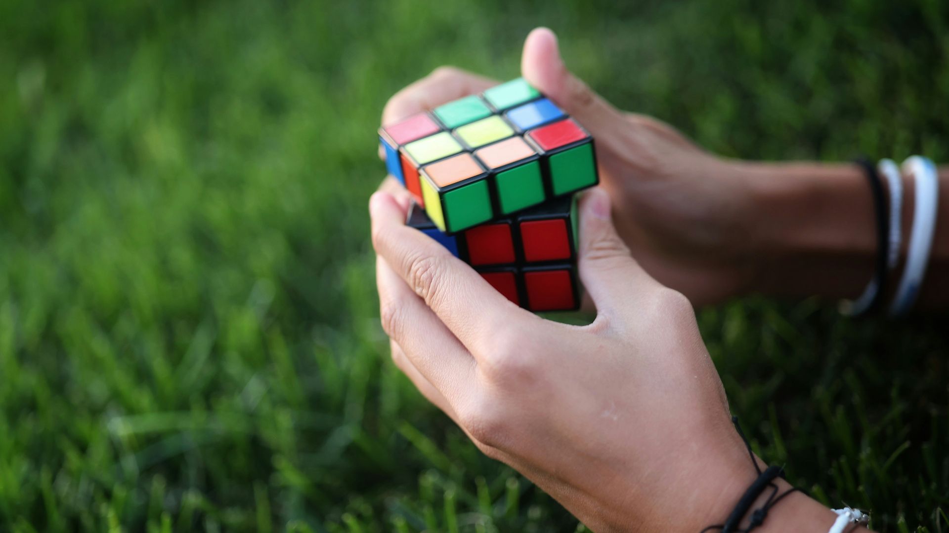 a person holding a cube