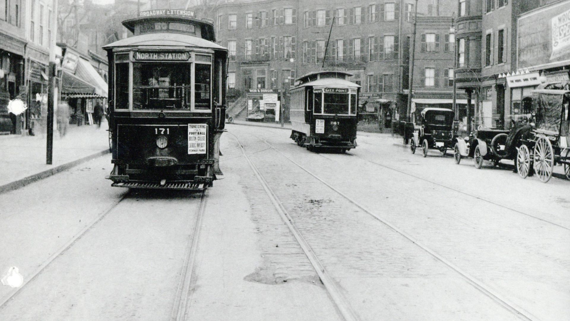 Two streetcars on West Broadway at Dorchester Street in 1917. The car at left is on the City Point - North Station route, later route 9. Both streetcars are older models, built before 1903.