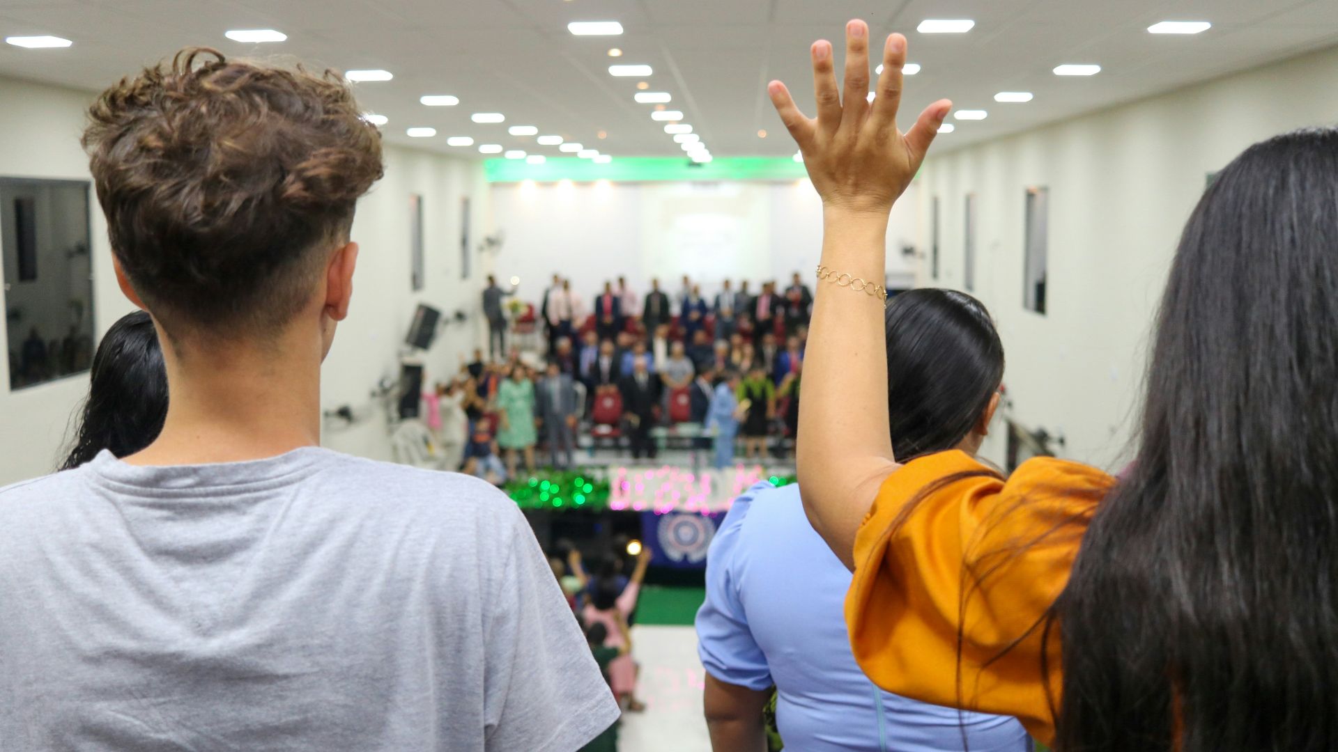 a group of people standing in front of a crowd