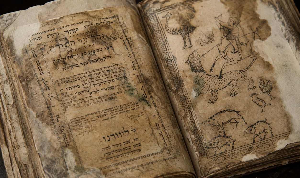 Aged Hebrew manuscript with illustrations