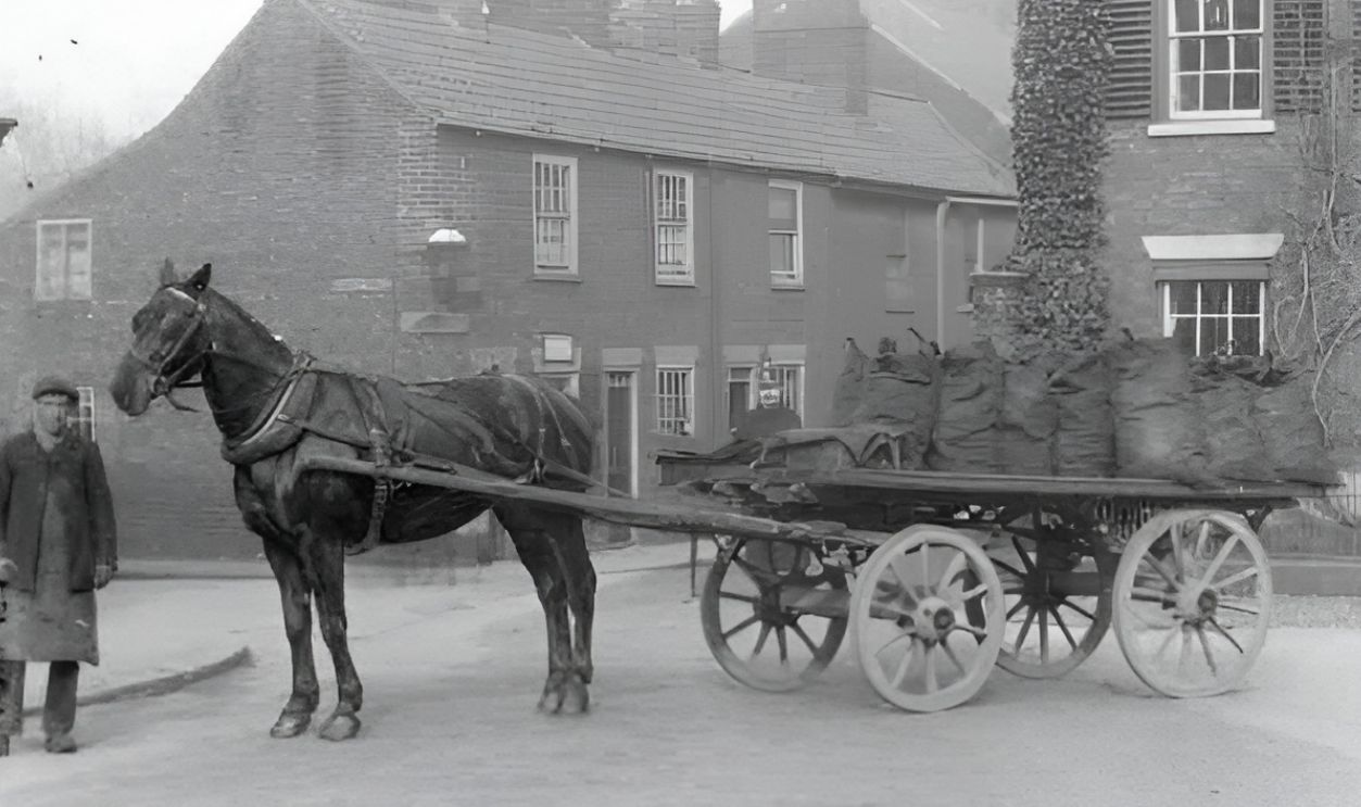 Man with cart of coal 