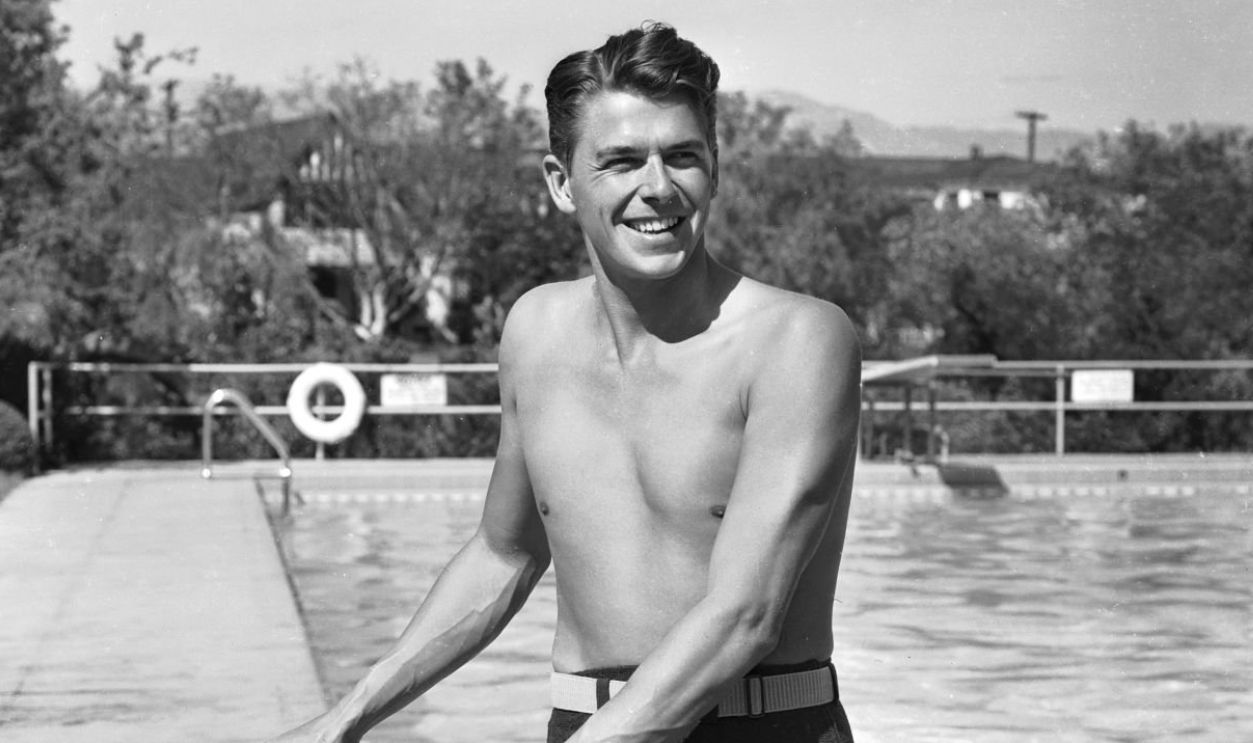 circa 1939: American leading man and future US President, Ronald Reagan emerging from a swimming pool.