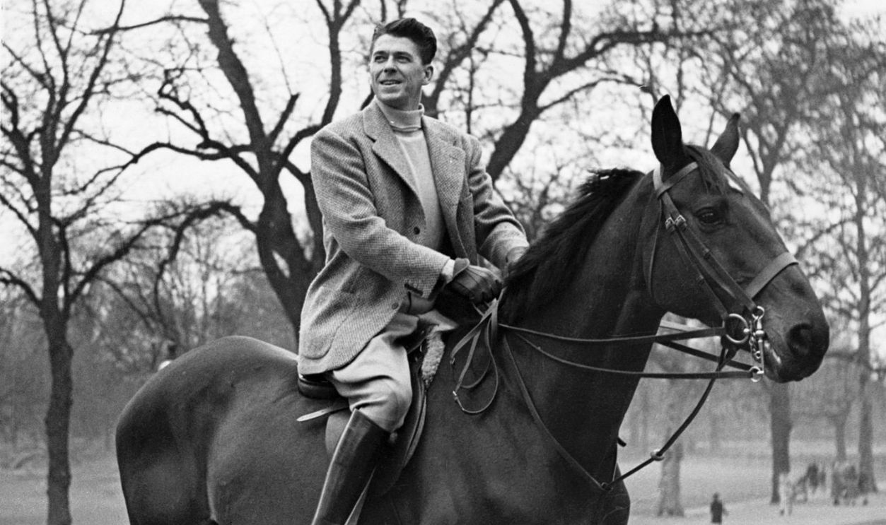 The American actor and future President, Ronald Reagan enjoys a horse ride during his 1949 visit to London.