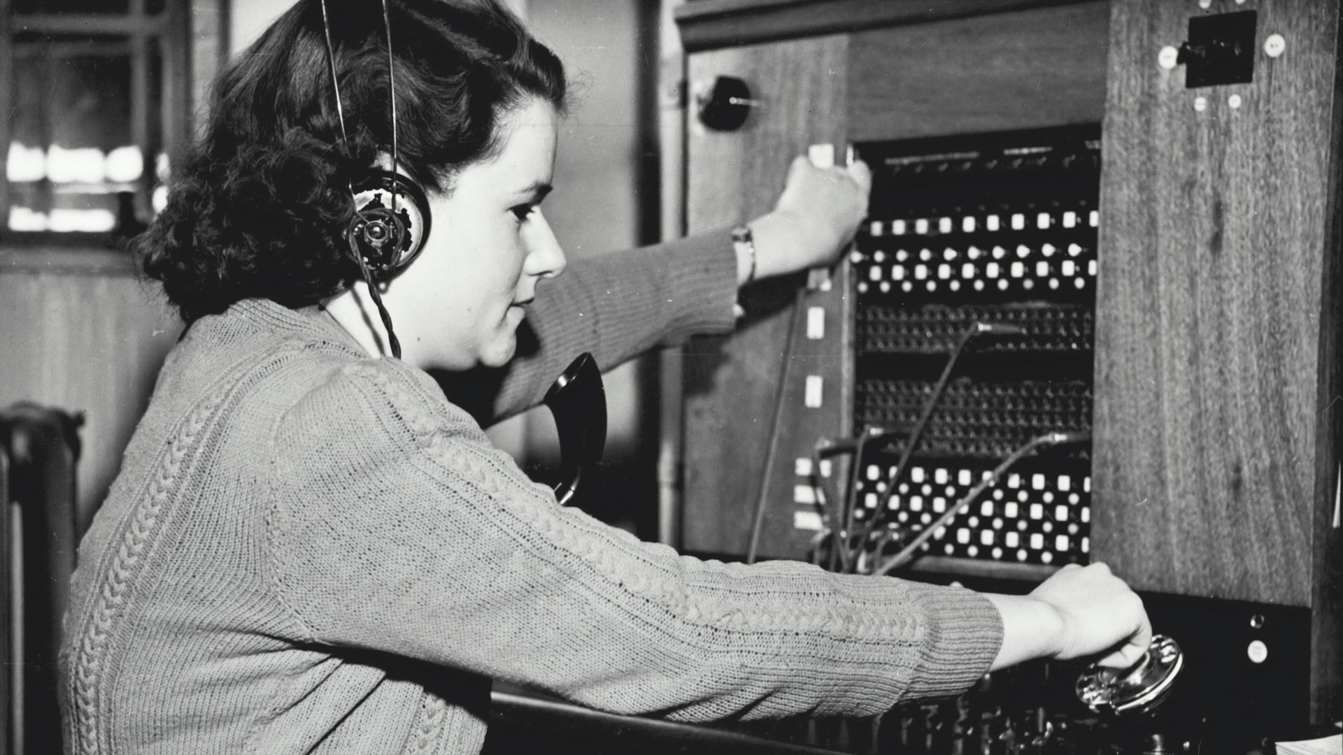 grayscale photo of woman using headphones