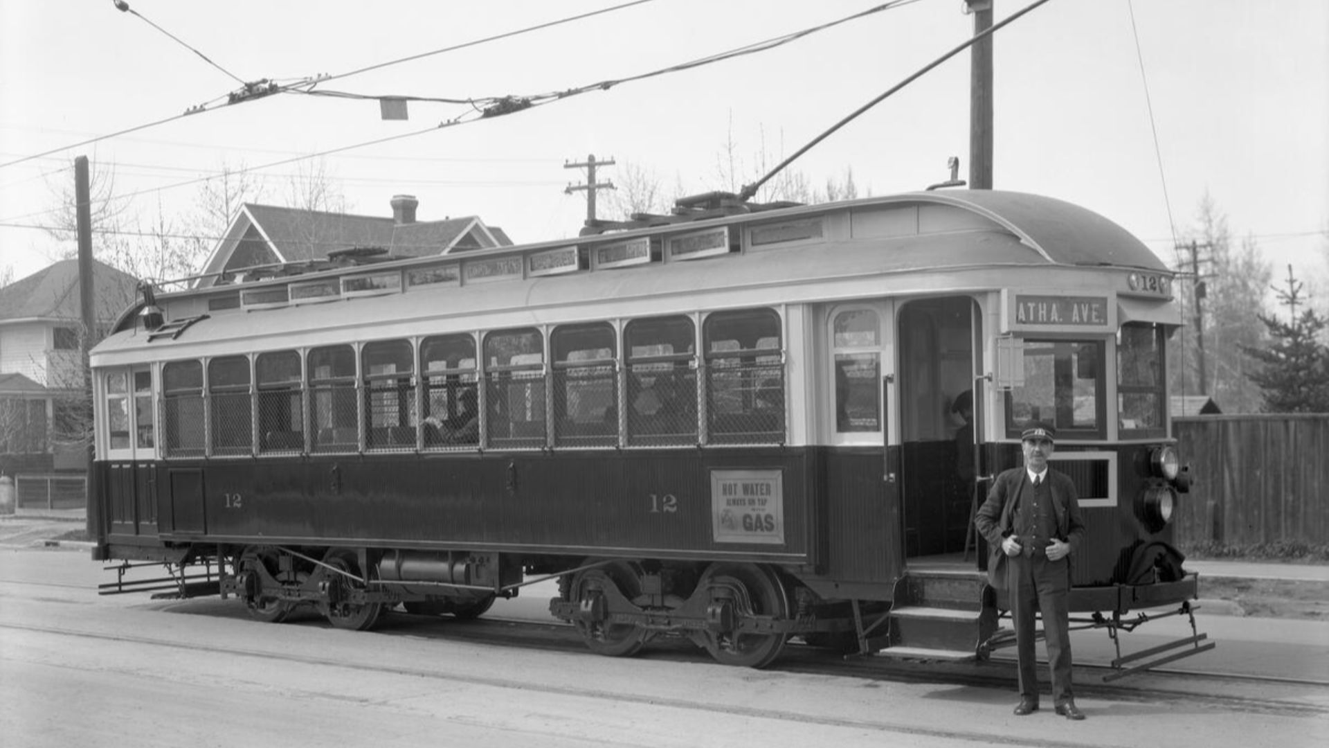 A conductor stands outside streetcar #12, 1929, one year before it was involved in a fatal accident