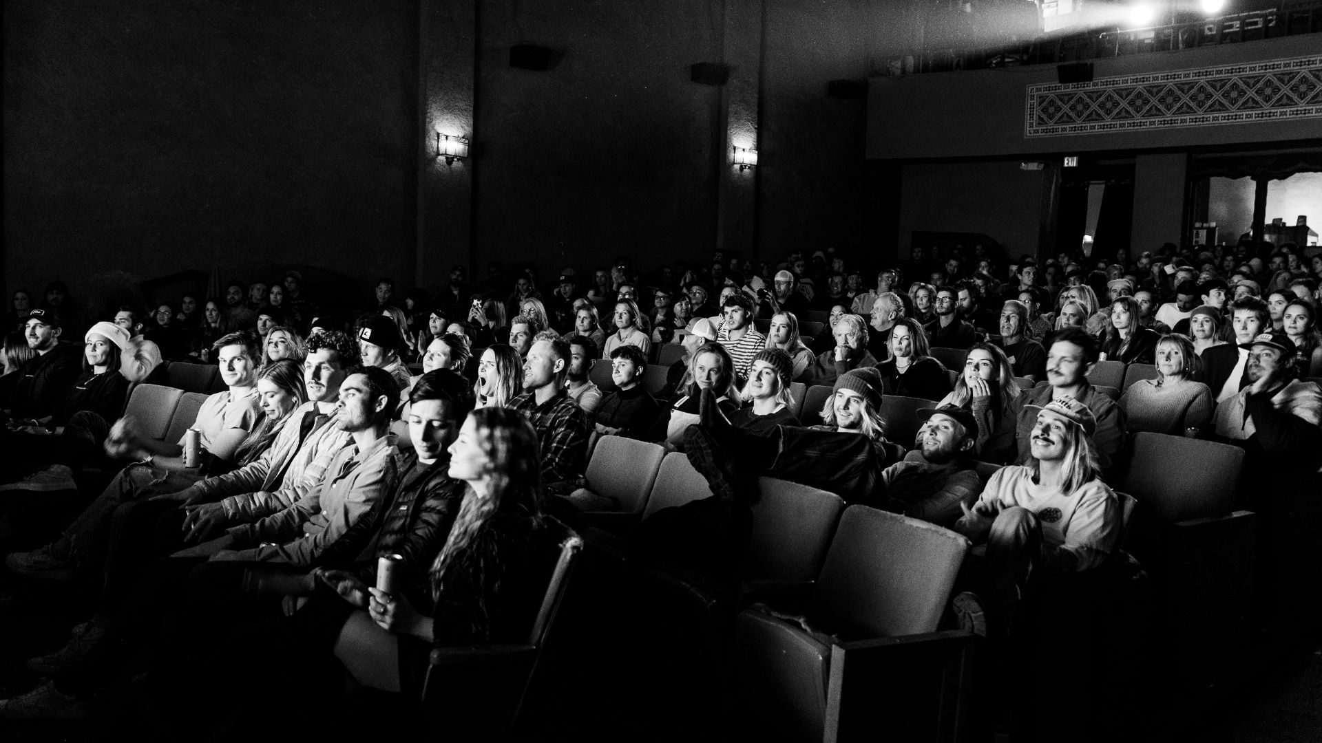 a black and white photo of a crowd of people