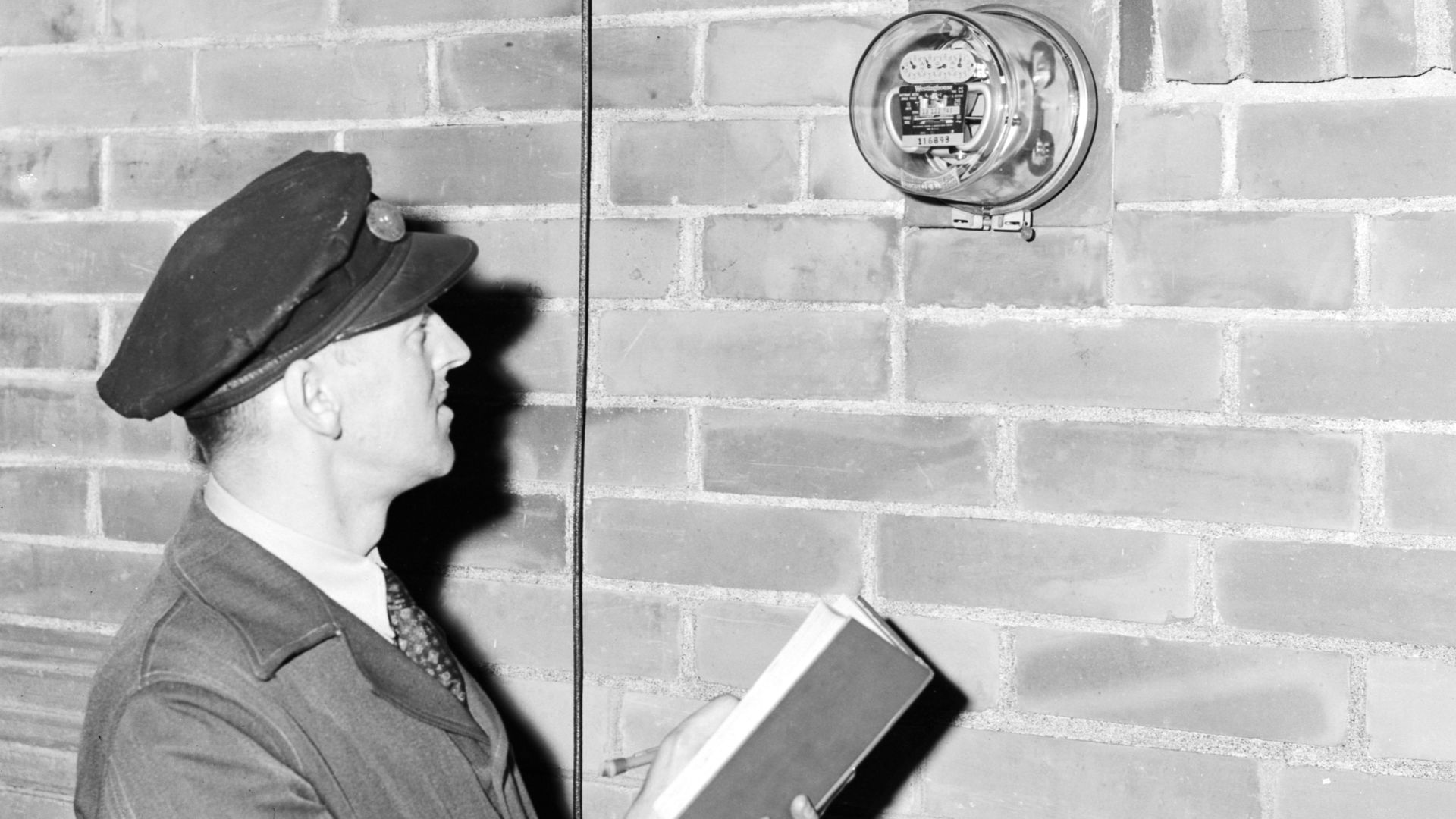 Reading an electric meter, Seattle, Washington, 1945.