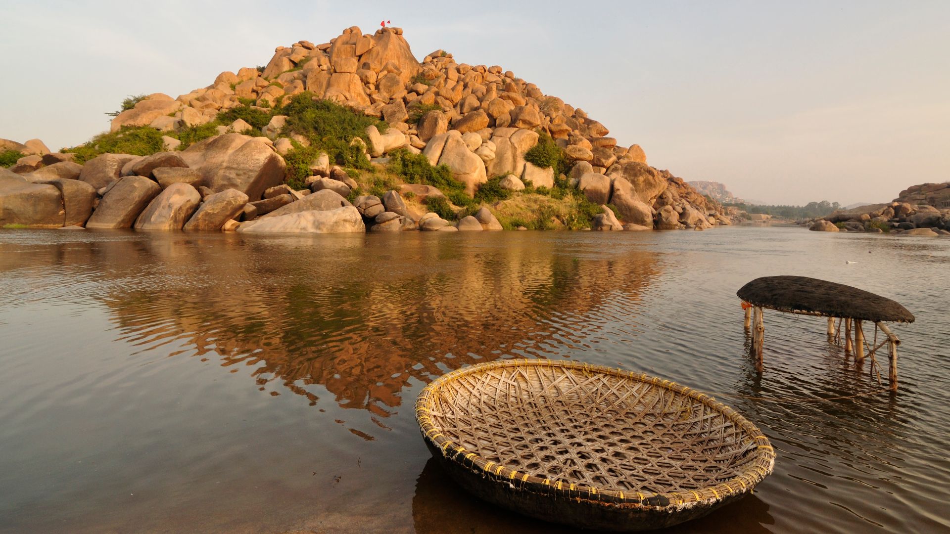 Couple of coracles (round-shaped boats) at Tungabhadra river near Hampi, India. Coracles are used as mode of water transportation in this part of the world.
Note: This photograph uses Adobe RGB color space. It is recommended that the photograph be vie