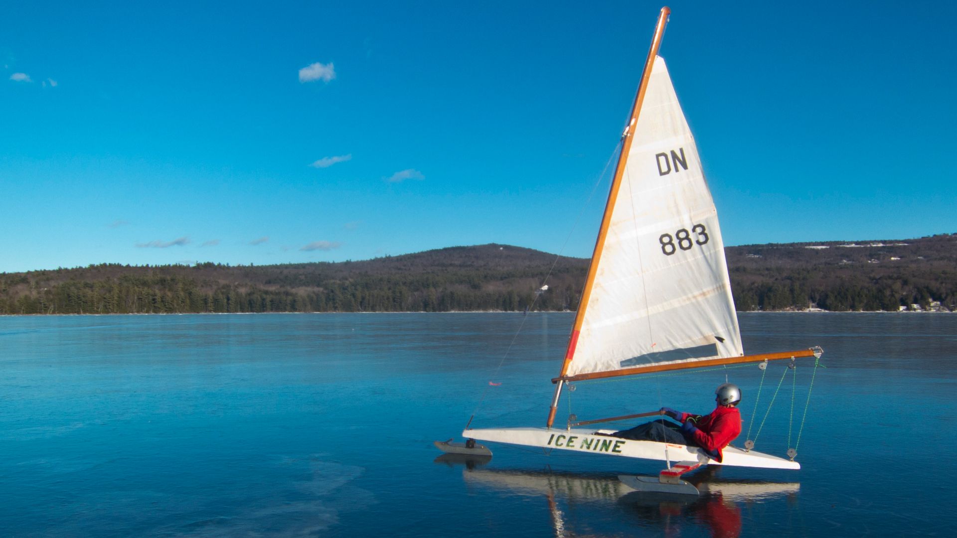 DN class iceboat, sailing on Lake Sunapee, New Hampshire in the U.S.A. Shown with a storm-sail.