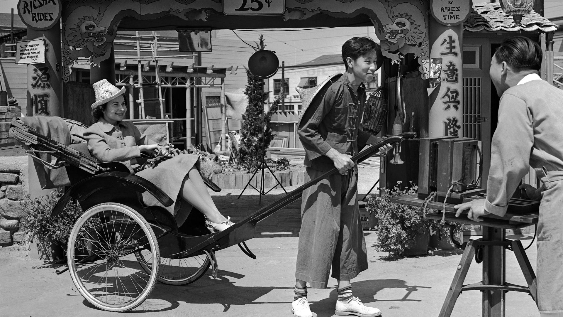 Title:  Rickshaw driver and passenger in Chinatown, Los Angeles (Calif.)