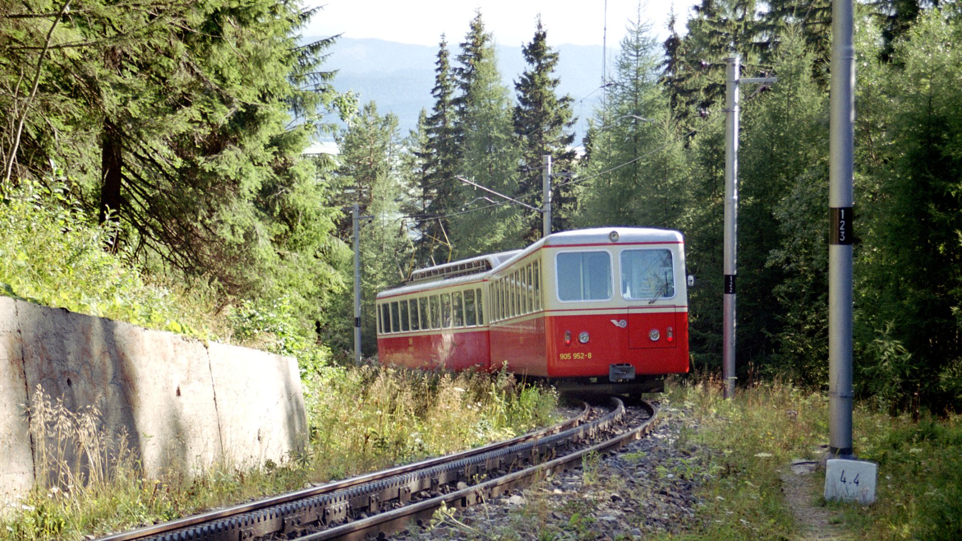 Multiple unit 405.95 of the rack railway Štrba–Štrbské Pleso, near the trainstation Štrbské Pleso driving down to Štrba