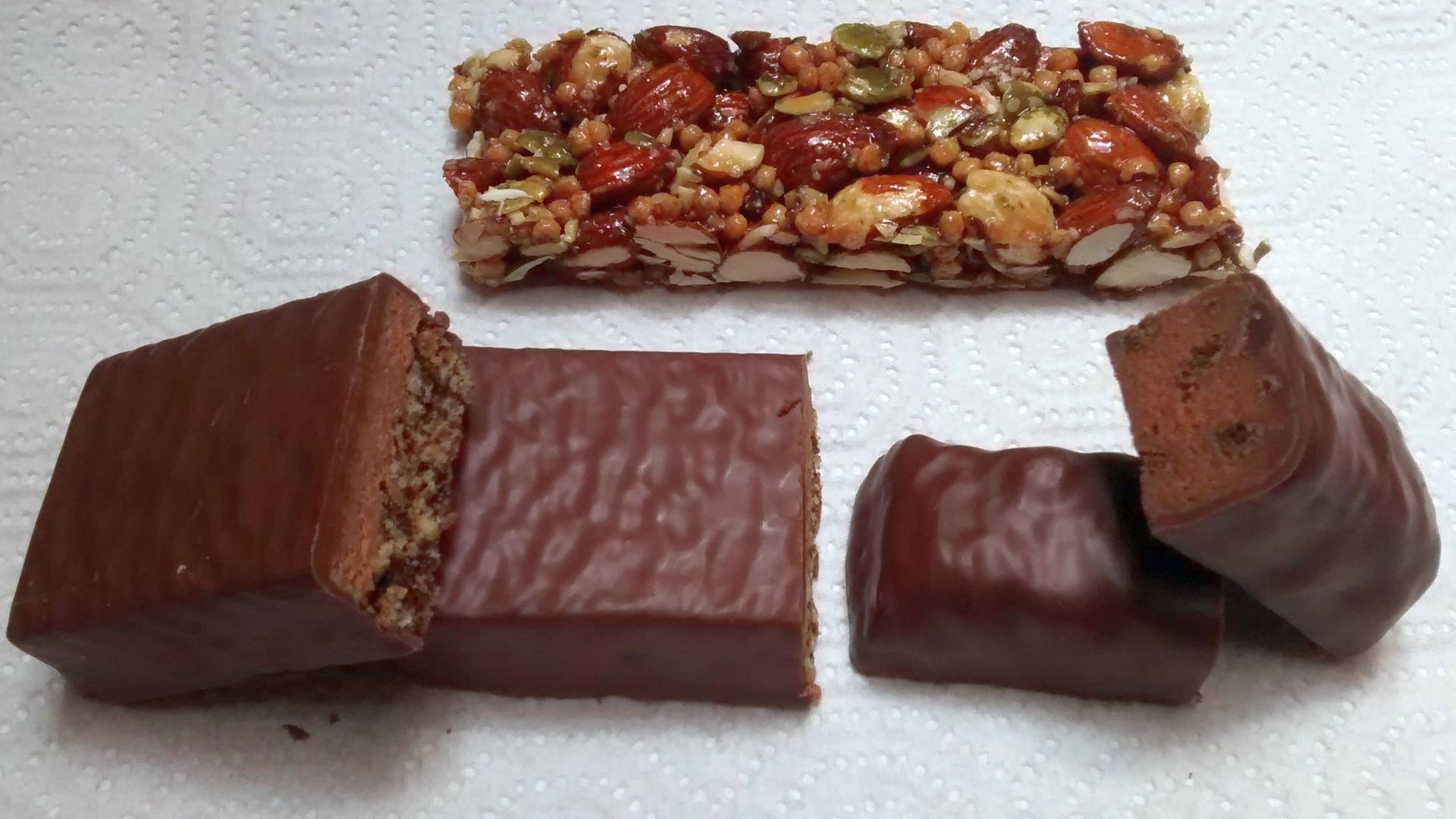 Top: STRONG & KIND Hickory smoked almond protein bar made by Kind (company)
Left: Clif Chocolate Mint Builder's Bar made by Clif Bar & Company

Right: LUNA Protein Mint Chocolate Chip bar made by Clif Bar & Company