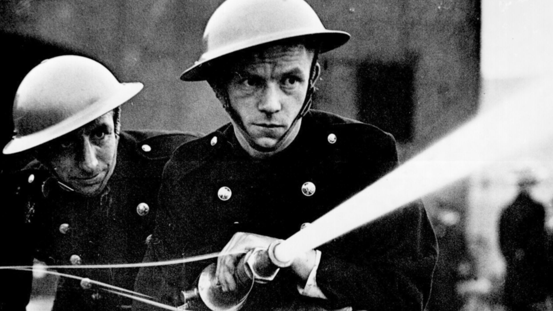 Over 500 firemen and members of the London Auxiliary Fire Fighting Services, including many women, combined in a war exercise over the ground covered by Greenwich (London) Fire Station. Ca. July 1939. 306-NT-901-19.
