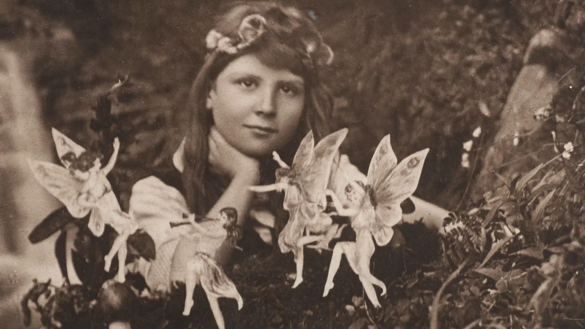 The first of the five photographs, taken by Elsie Wright in 1917, shows Frances Griffiths with the alleged fairies.