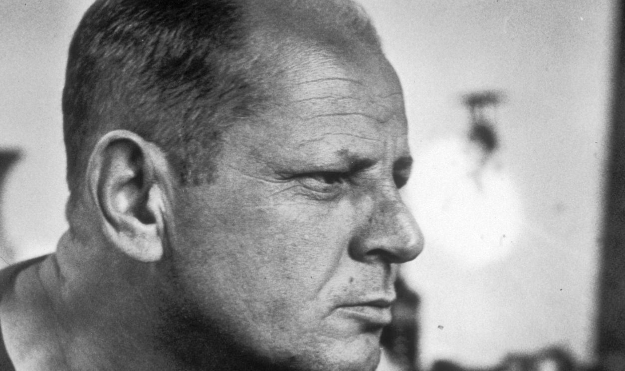 August 1953: Profile headshot portrait of American Abstract Expressionist painter Jackson Pollock (1912 - 1956) in his studio, New York City.