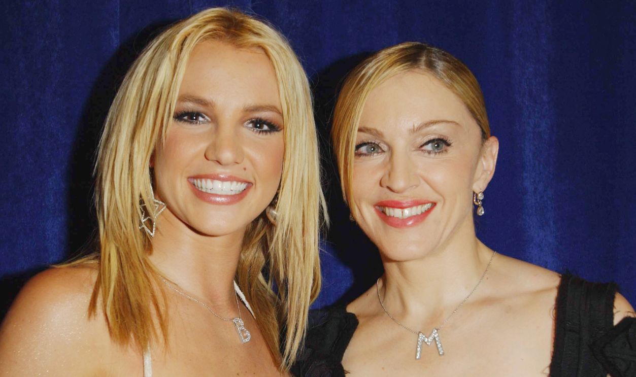 Britney Spears(L) and Madonna poses backstage during the 2003 MTV Video Music Awards at Radio City Music Hall on August 28, 2003 in New York City