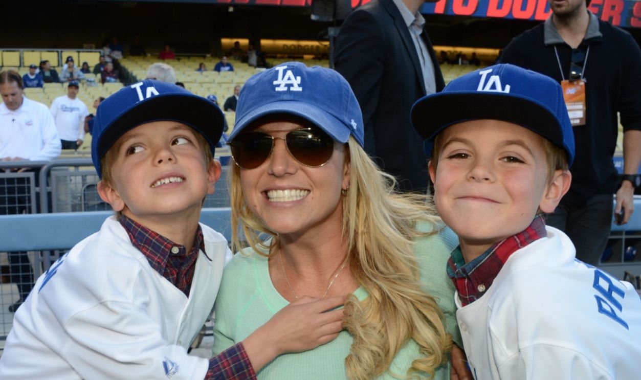 Britney Spears poses with sons Jayden James Federline (L) and Sean Preston Federline (R) during a game against the San Diego Padres at Dodger Stadium on April 17, 2013 in Los Angeles, California