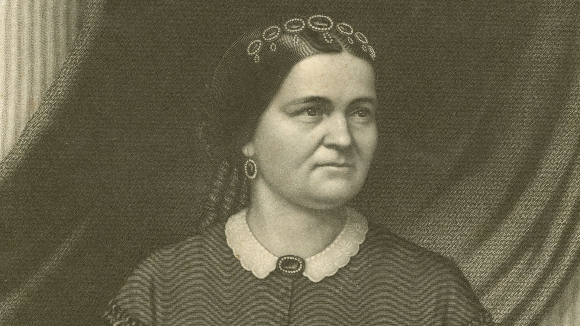 Half-length portrait of a seated woman in a dark colored dress with a white collar holding a fan in her left hand.