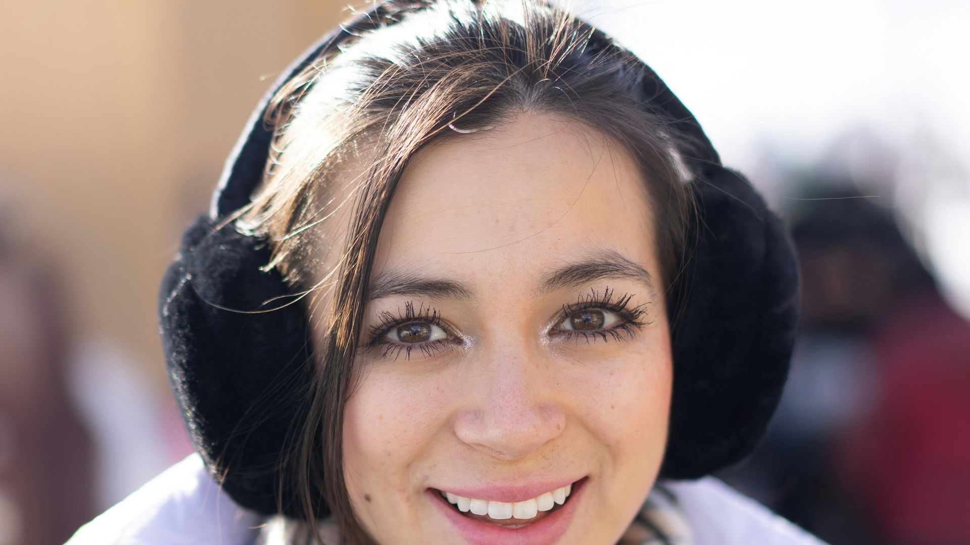 a woman wearing a scarf and a hat