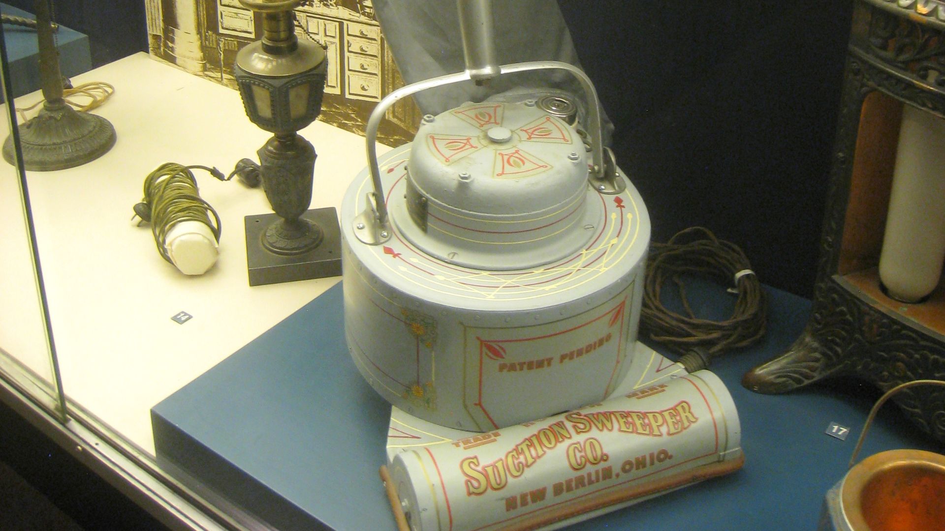 Early electric vacuum cleaner by Electric Suction Sweeper Company, circa 1908, predecessor of Hoover vacuum cleaner (1922). Exhibit in National Museum of American History, Washington, DC, USA.