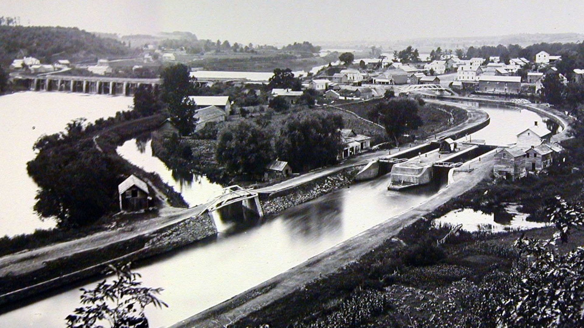 Scope and content:  The original finding aid described this photograph as:
Original Caption: This photo shows the early years of the Erie Canal as its stone aqueduct passes through Rexford.
Location: Rexford, New York

Status: Public domain. Original of t