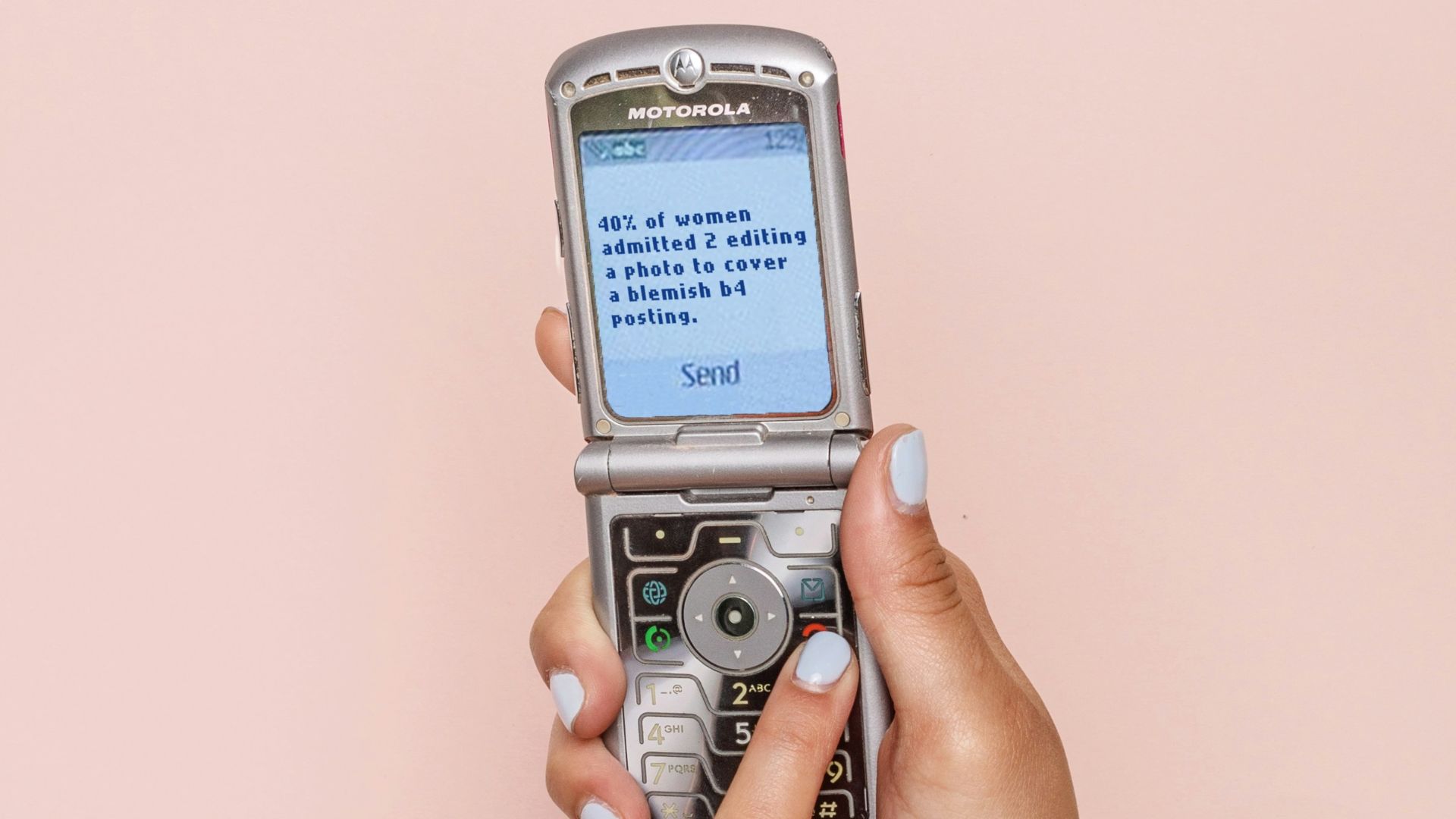 turned-on silver flip phone