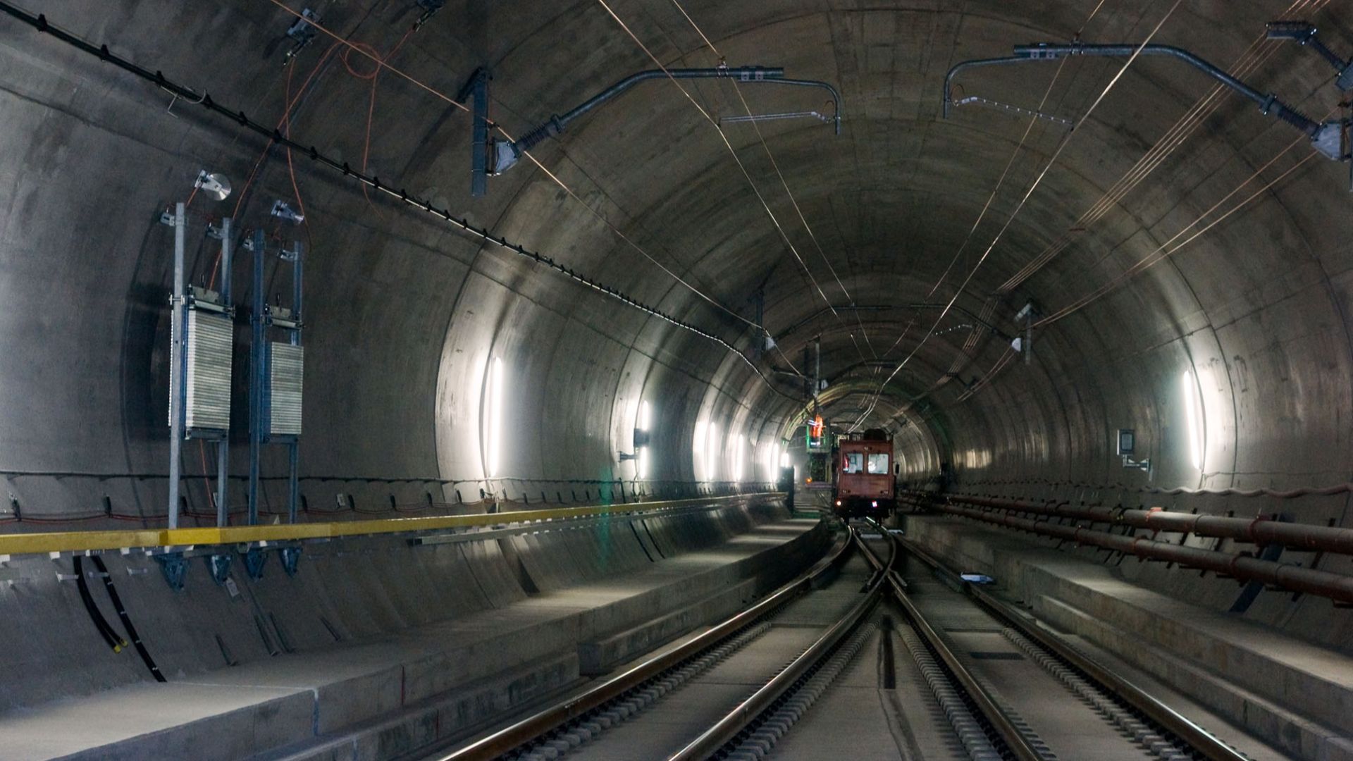 Overhead line installation car in the east tube of the Gotthard Base Tunnel at Faido multifunction station