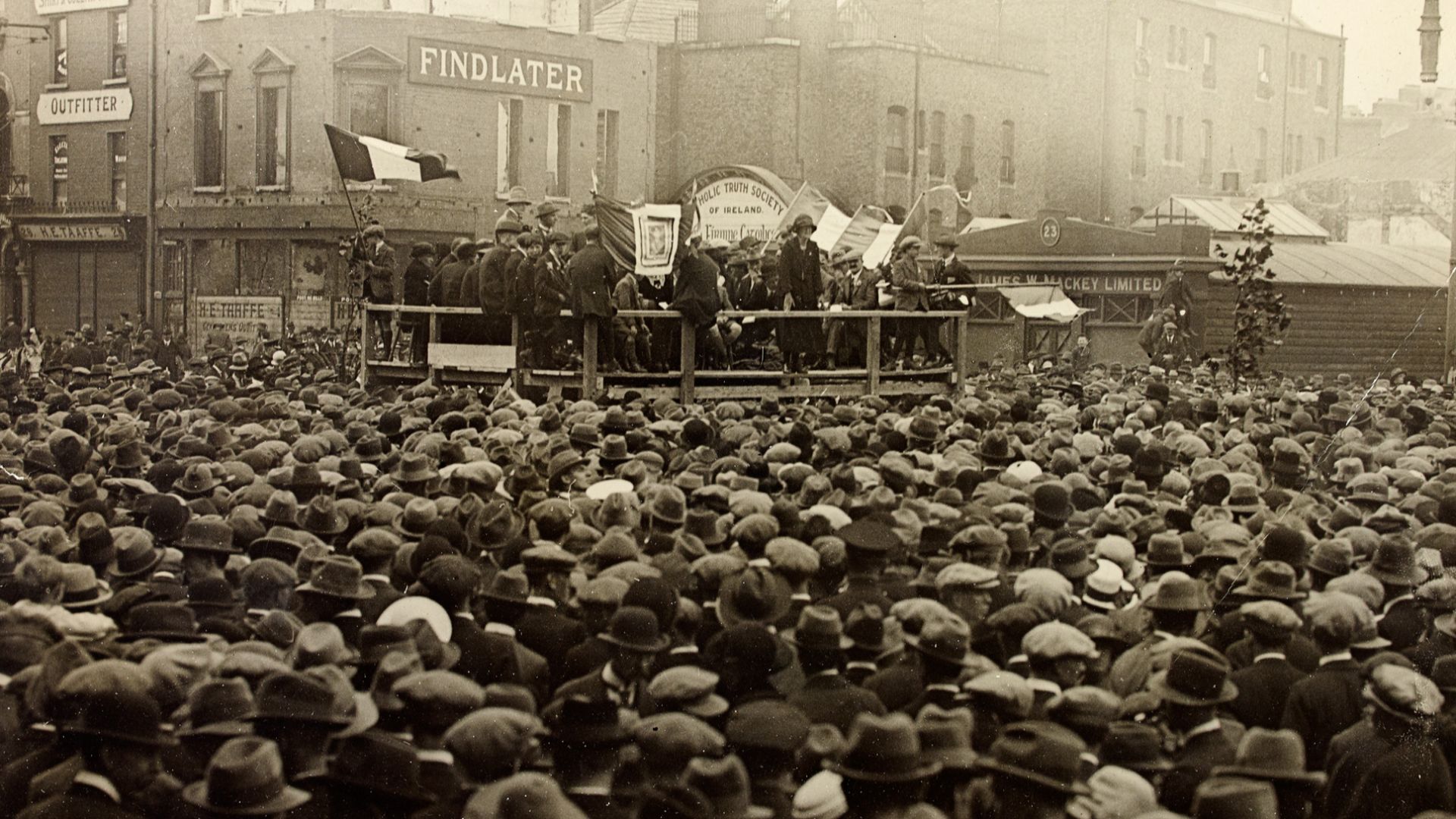 A very crowded Republican meeting in Dublin. Our metadata says this took place on O'Connell Street, or Sackville Street as it was then, and I have tagged with these names, but I am just not convinced that this was the location. So please feel free to weig
