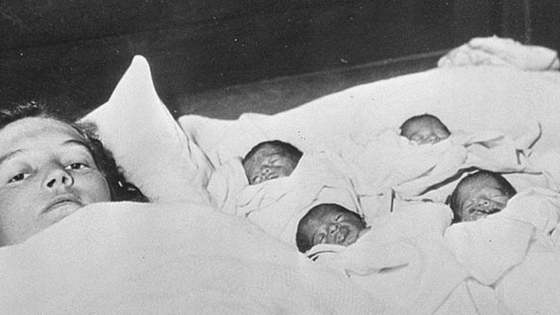 Dionne quintuplets with their mother.