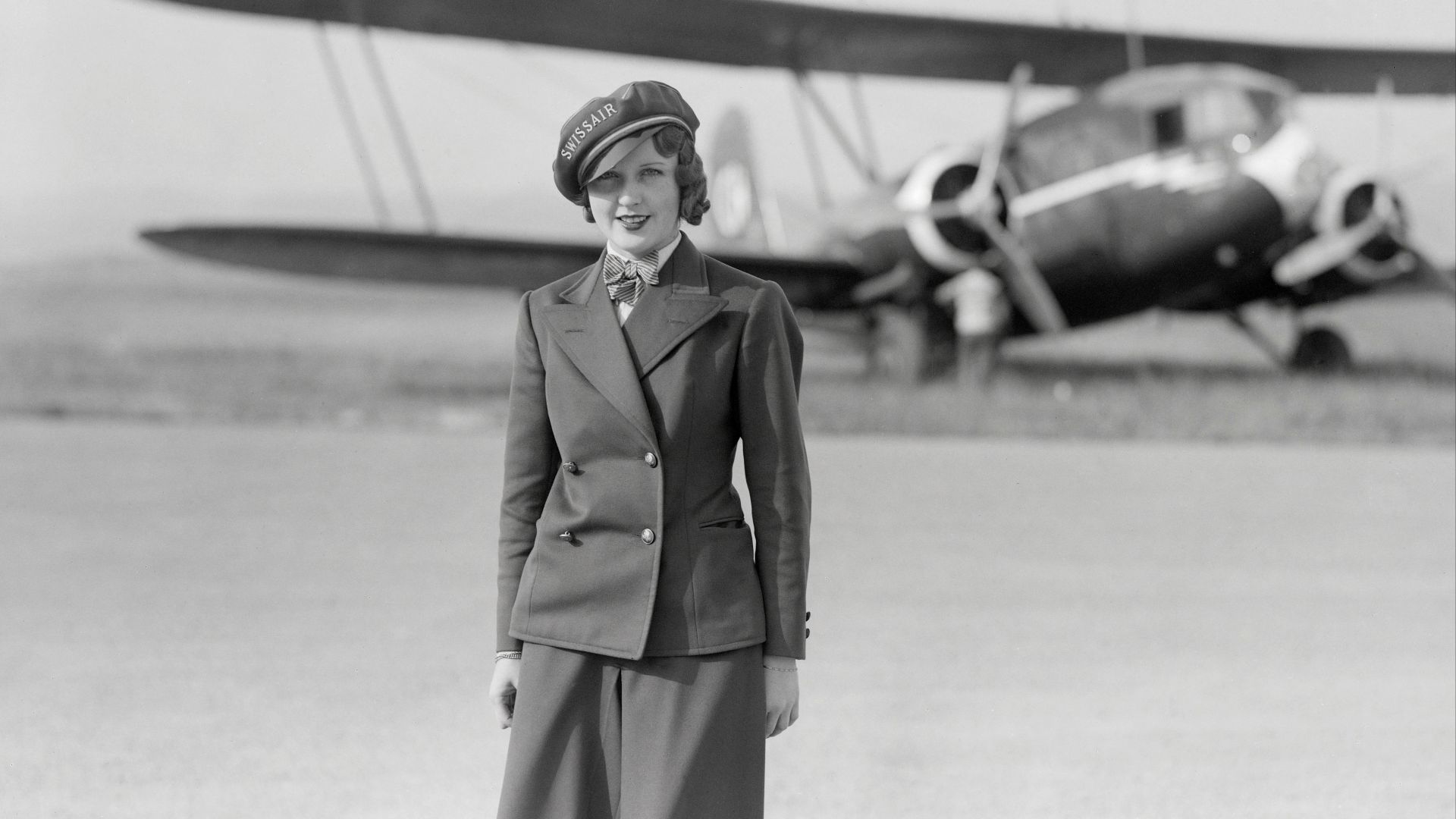 Nelly Diener, the first air stewardess in Europe, standing in front of the Curtiss AT-32C Condor II, regn. CH-170, in which she would lose her life on 27 July 1934.