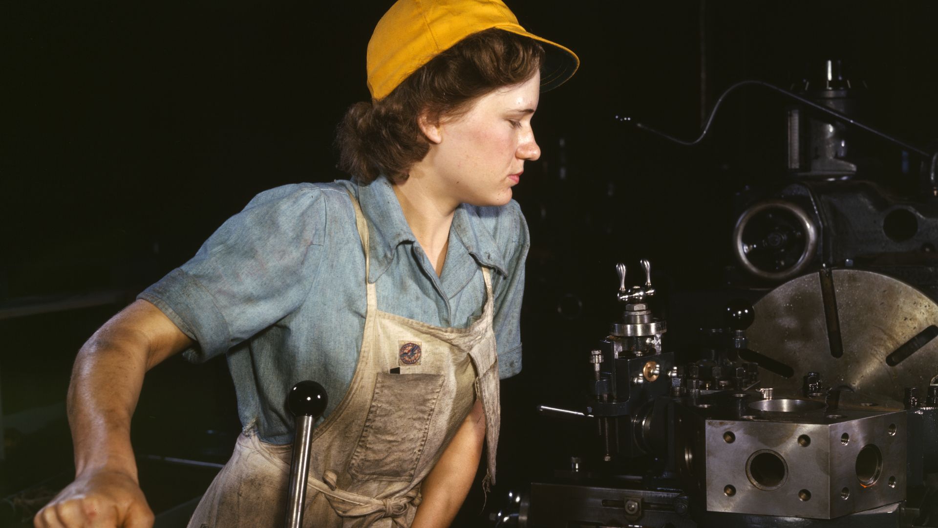 Turret lathe operator machining parts for transport planes at the Consolidated Aircraft Corporation plant, Fort Worth, Texas, USA.
