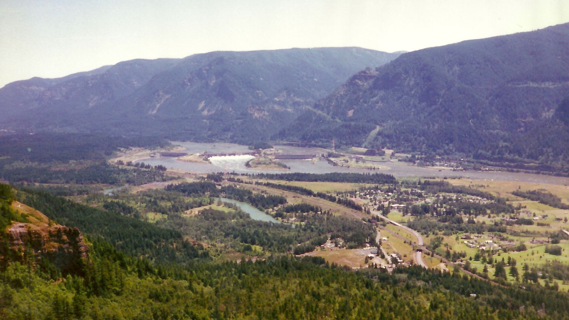 Bonneville Dam and North Bonneville, Washington from Beacon Rock State Park, WA. The mountains of Oregon can be seen across the Columbia River.
