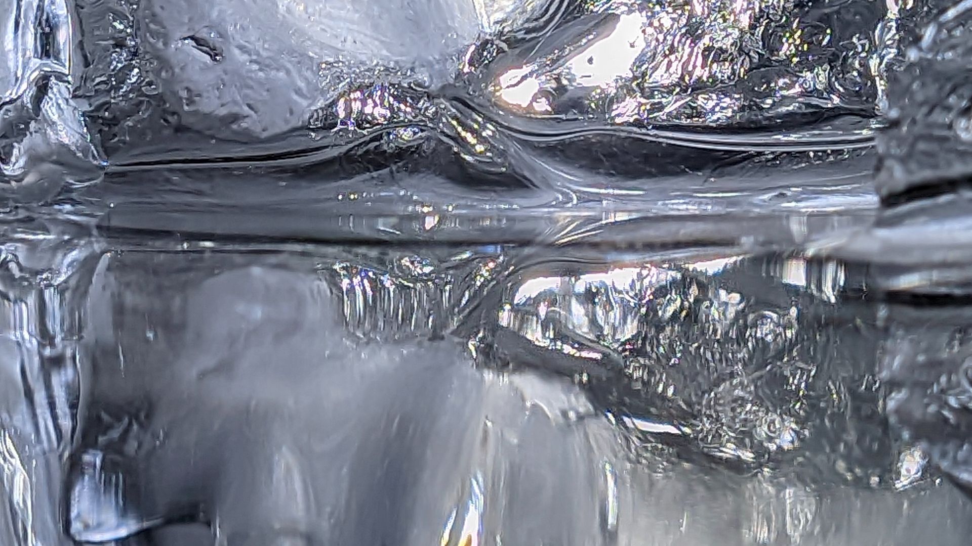 Bottle of water in the fridge is absolutely ice!
After keeping it at room temperature for a while, the ice inside the bottle starts to melt.

Inside view of water bottle