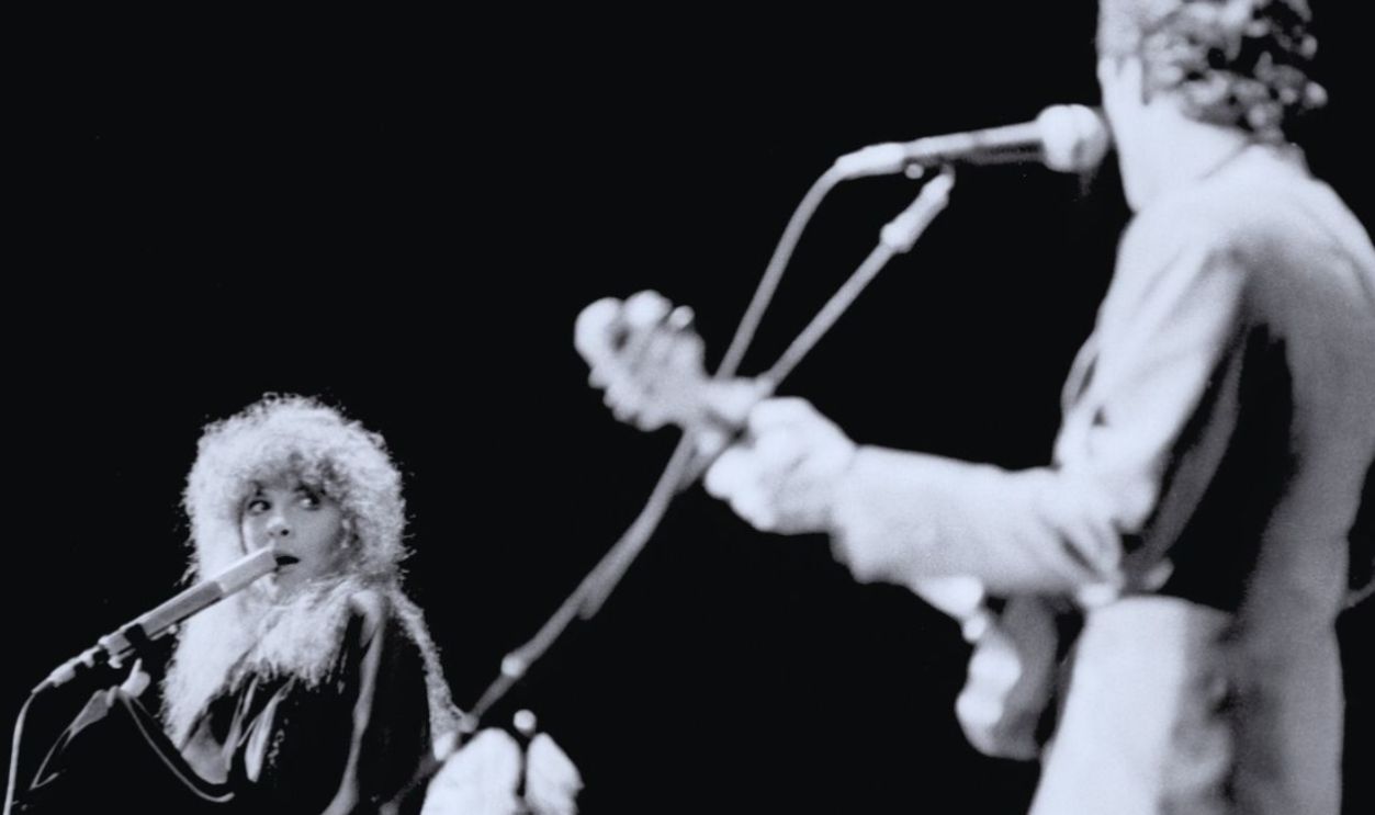 American musicians Stevie Nicks of the group Fleetwood Mac performs onstage at the Los Angeles Forum, Inglewood, California, December 6, 1979. In the foreground is American musician Lindsey Buckingham. 