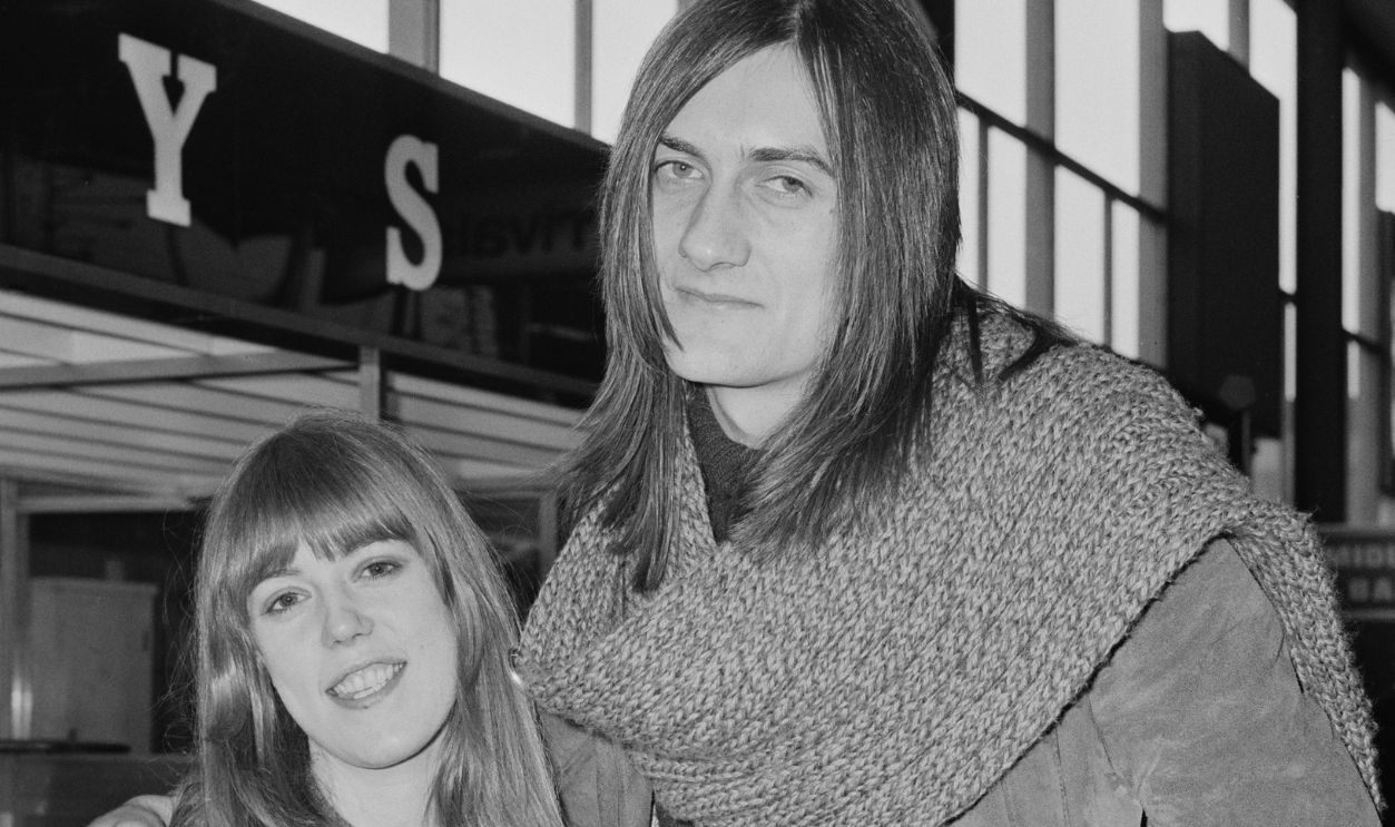 English model Jenny Boyd and British musician and actor Mick Fleetwood of rock band Fleetwood Mac at Heathrow Airport, London, UK, 21st February 1970.